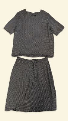 a black and white shirt and skirt set with polka print