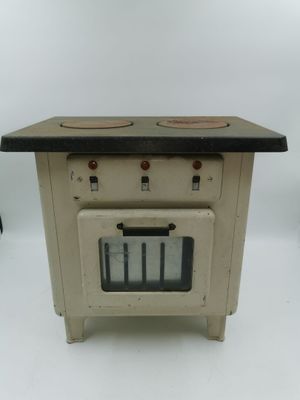 une petite cuisinière avec deux feux dessus