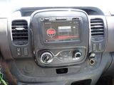 a dashboard of a car with a digital display on it
