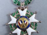 an image of a medal with a red ribbon around it