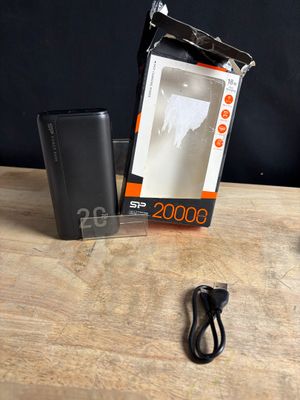a box with a charger and a charger on a table