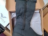 a box with a pair of boots inside of it