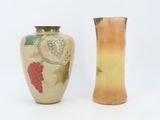 two vases sitting next to each other on a white surface