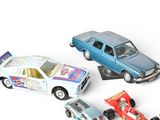 several toy cars are lined up in a row on a white surface