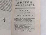 a book open on a table with a picture of the title