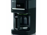 the coffee maker is black and has a digital clock on the side