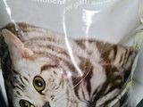 a bag of cat food with a picture of a cat inside of it