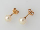 a pair of pearl and gold earrings