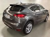 a picture of a grey car in a showroom