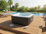 un jacuzzi installé sur une terrasse à côté d'une piscine