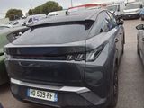 many cars parked in a parking lot near each other