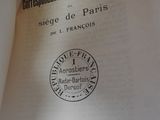 an open book with a stamp on it sitting on a table