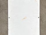 an overhead view of a white metal plate on a concrete floor