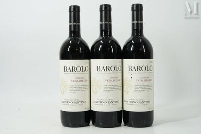 three bottles of wine sitting on top of a white table