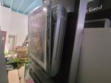 a picture of a refrigerator and a microwave in a room