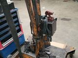 an image of a fork lifter in a garage