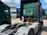 two trucks that are parked next to each other
