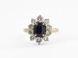 a close up of a black and white diamond ring on a white background