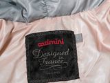 an image of a pink jacket with a black label on it