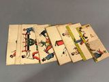 four cards of children ' s playing games on a table