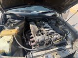 a car that has a broken engine in the back of it