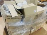 a pile of boxes sitting on the floor in a room