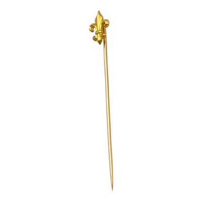 broche en forme de fleur plaquée or, représentant une seule fleur sur fond blanc