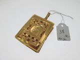 a close up of a gold locke with a price tag on it