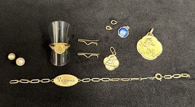 a lot of jewelry that is laying out on the table