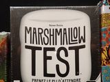a box of marshmallow test next to a can of beer