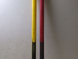 two baseball bats sitting next to each other on a table