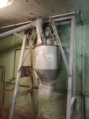 a picture of a room with pipes and a water heater