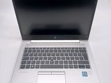 a laptop computer that is sitting on a white table