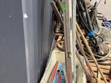 a pile of tools sitting on top of a pallet next to a building