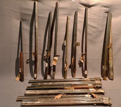 many different types of weapons displayed on the wall