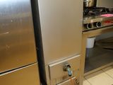 a kitchen with a stove and a refrigerator in it