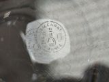 a close up of a person ' s face with a sticker on it