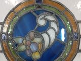 a stained glass window with a flower on it
