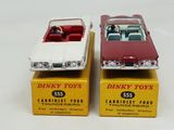 two toy cars that are sitting on top of each other