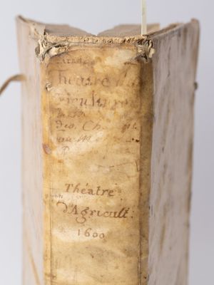 an old book with writing on it sitting on top of a table