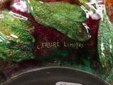 a close up of a vase with a painting on it