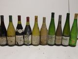 bottles of wine are lined up in a row on a table