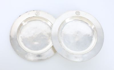pair of silver plated dishes on a white background