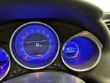 a close up of a car dashboard with blue lights
