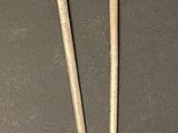 pair of antique silverware spoons with a lion head on them