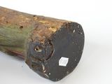a small piece of wood with a hole in it