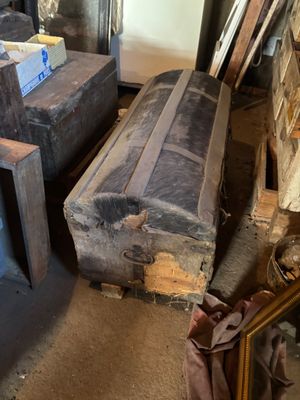 several pieces of luggage are stacked on top of each other in a room