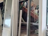 a picture of a room that has a lot of windows in it