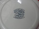 a white plate with a blue and white design on it