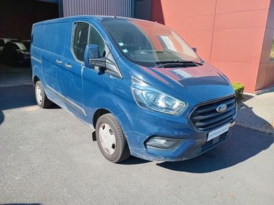 a blue van parked in front of a building
